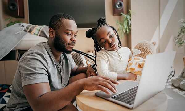 dad & daughter on laptop