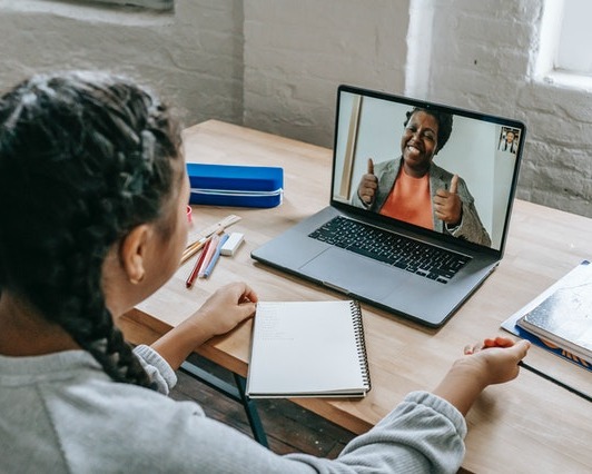 girl at desk on video call